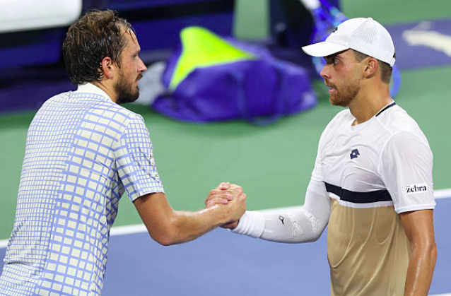 Daniil Medvedev and Benjamin Bonzi share a moment at the net. Source: Getty