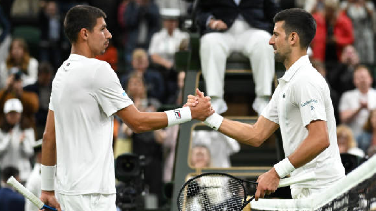 Alexei Popyrin and Novak Djokovic at the US Open 2024. Photo: Getty