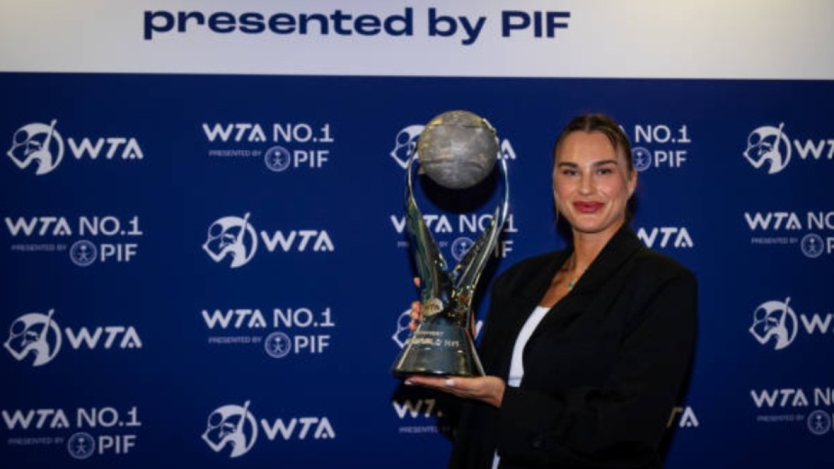 Aryna Sabalenka with the number one WTA trophy