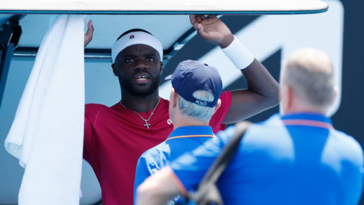The viral image of Tiafoe vomiting in the middle of his match at the 2025 Australian Open. Photo: Getty