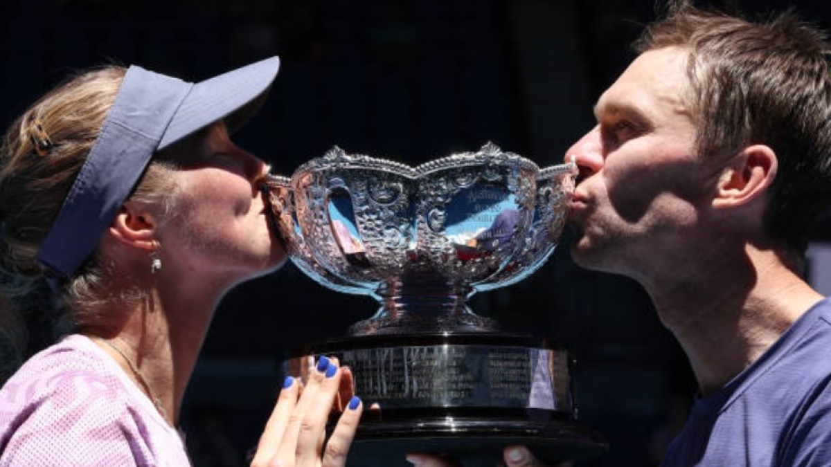 Olivia Gadecki and John Peers with the mixed doubles trophy at the 2025 Australian Open. Photo: Getty
