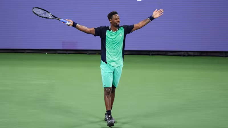 Tien dit un dernier adieu à Monfils lors des Grands Chelems. Source : Getty Images.