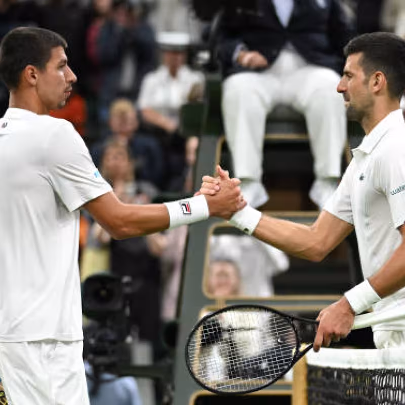 Alexei Popyrin and Novak Djokovic at the US Open 2024. Photo: Getty