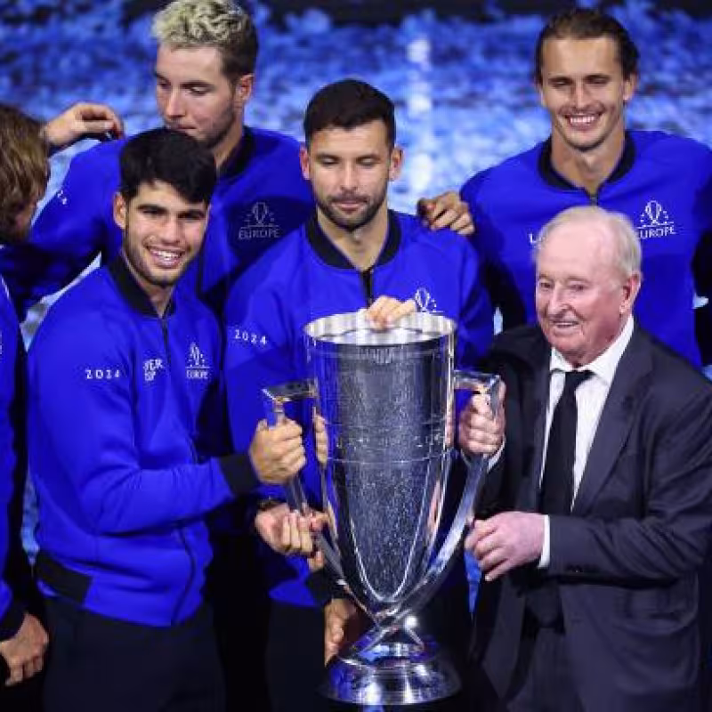The European team celebrates victory with Rod Laver.