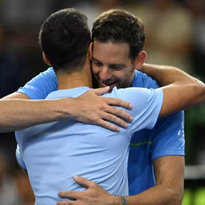 Juan Martín del Potro embraces Djokovic after his farewell match.