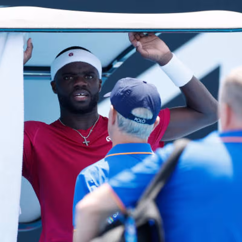The viral image of Tiafoe vomiting in the middle of his match at the 2025 Australian Open. Photo: Getty