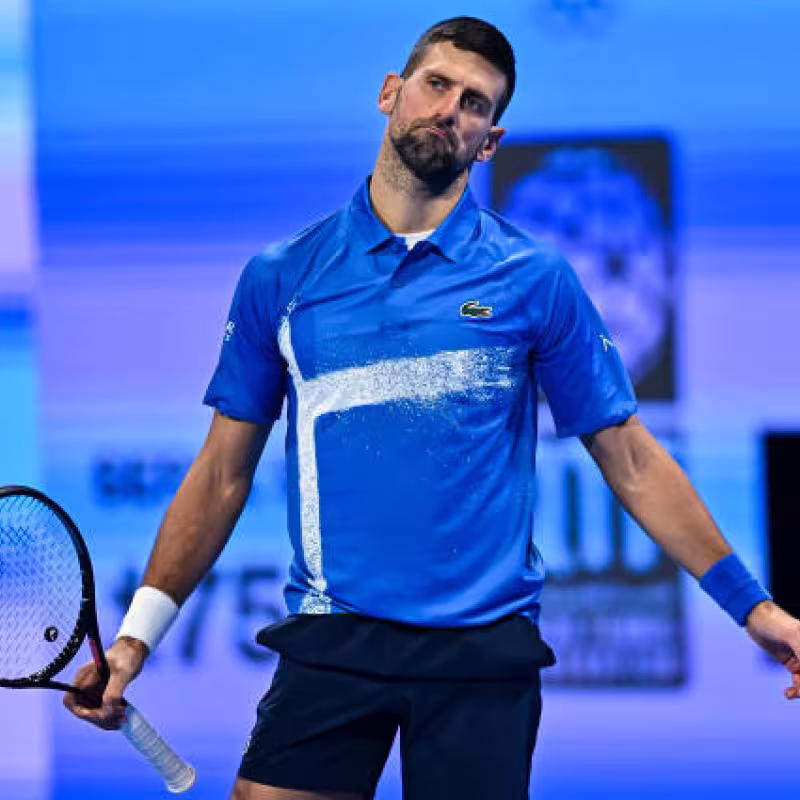 Djokovic caught leaving Doha with a strong limp. Photo: Getty