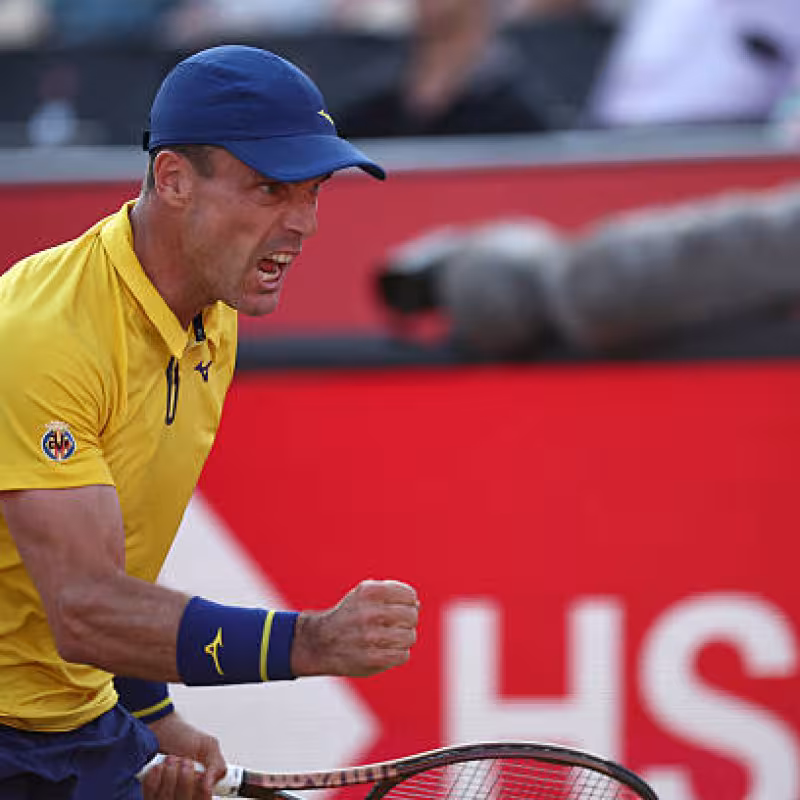 Bautista shows guts to secure an epic victory over Rune. Photo: Getty