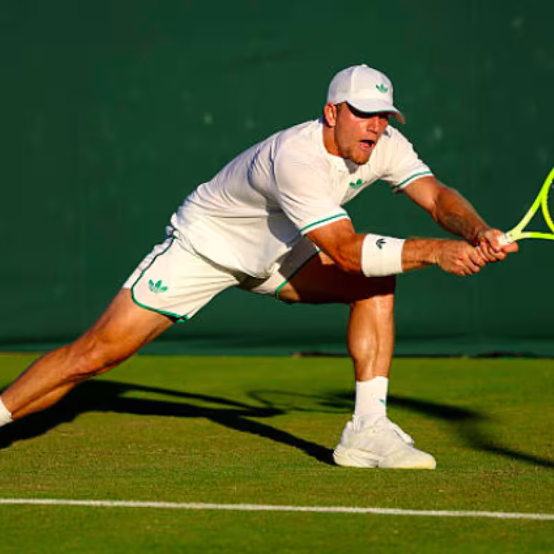 Alejandro Davidovich analyzes the grass at Wimbledon. Source: Getty