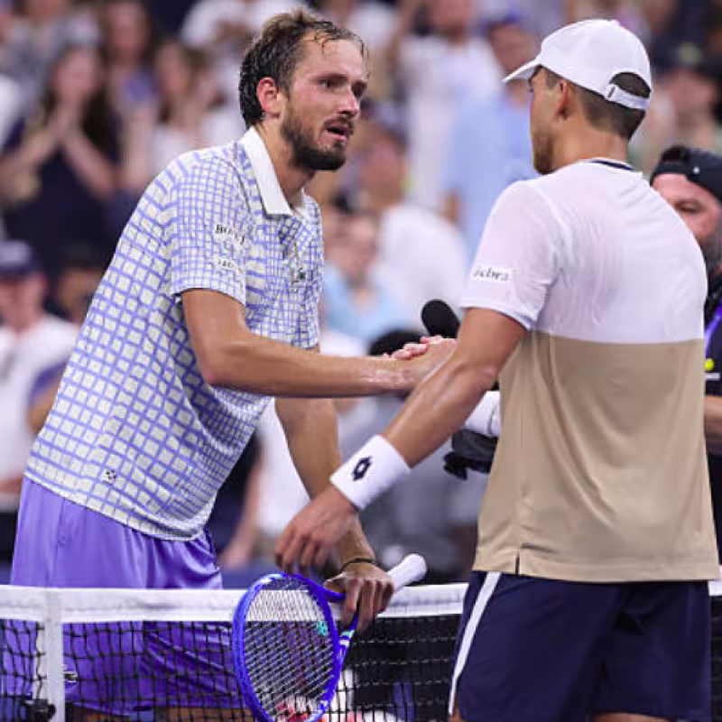 Daniil Medvedev with Benjamin Bonzi at the net. Source: Getty