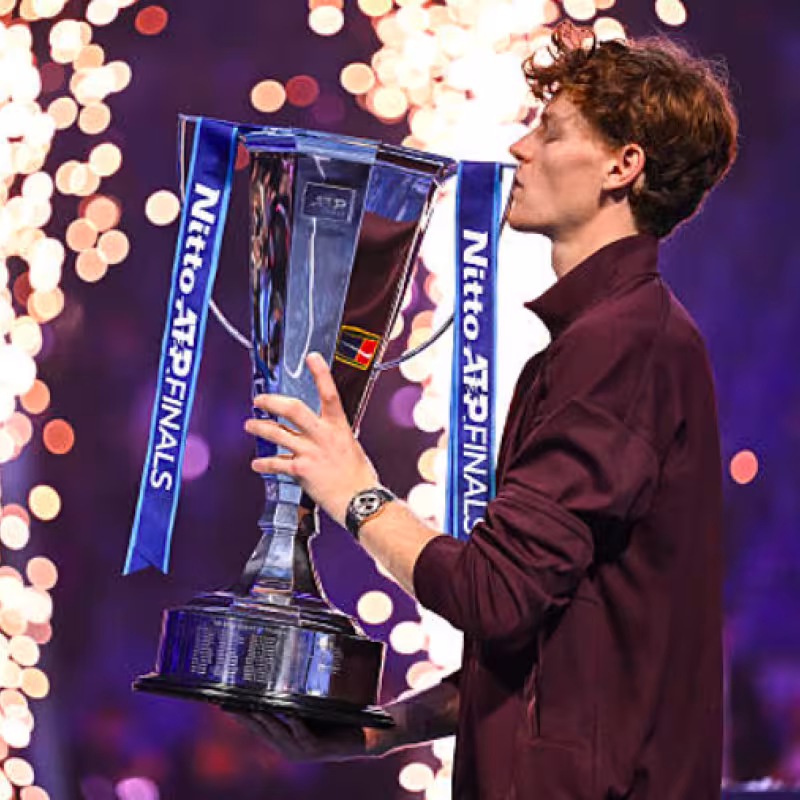 Jannik Sinner poses with the title of the ATP Finals 2025. Source: Getty